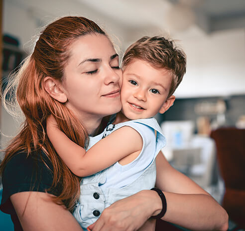 mother hugging her young son