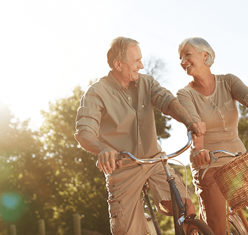 senior couple riding bikes