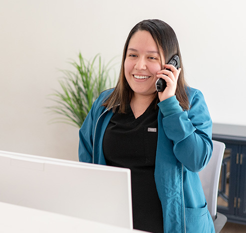 woman handing in paperwork