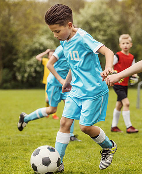 boy playing soccer