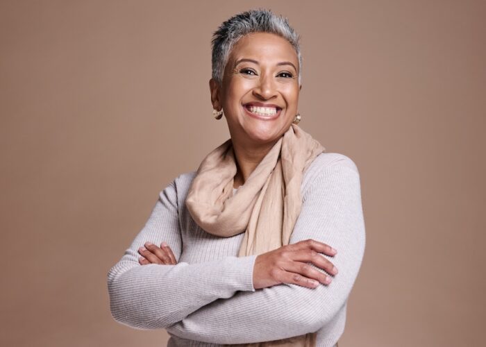 woman smiling after cosmetic dentistry helped her with a youthful smile